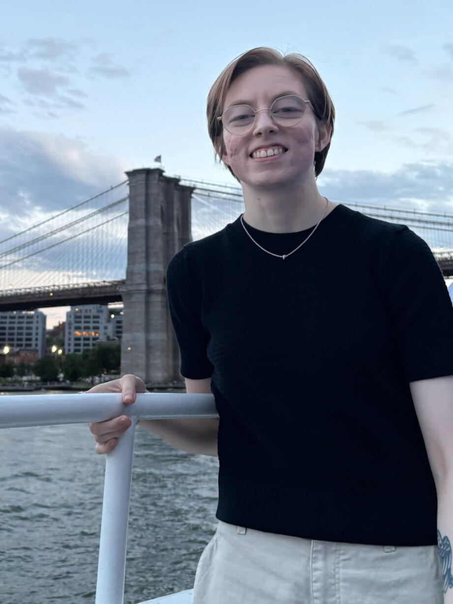 Lauren Brendle Lauren Brendle seated outdoors with the Manhattan skyline behind her